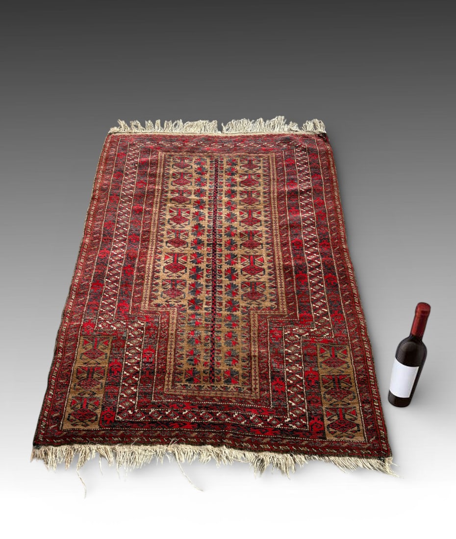 ANTIQUE TURKOMAN (TURKMEN) TYPE PRAYER RUG: ANTIQUE TURKOMAN (TURKMEN) PRAYER RUG, BOKHARA-TYPE, WOOL ON WOOL, C. 1880–1920: Antique Turkoman prayer rug of Bokhara type, featuring a stepped architectural mihrab and repeating geometric motifs