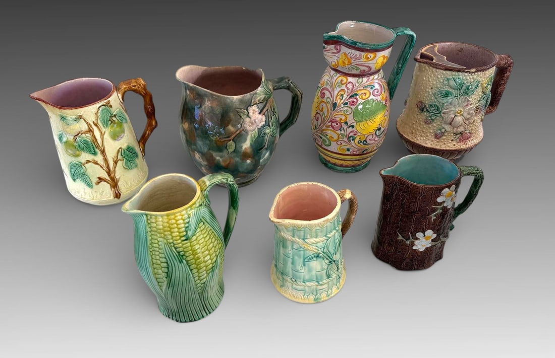 7 PC. MAJOLICA PITCHERS (1 of 3)