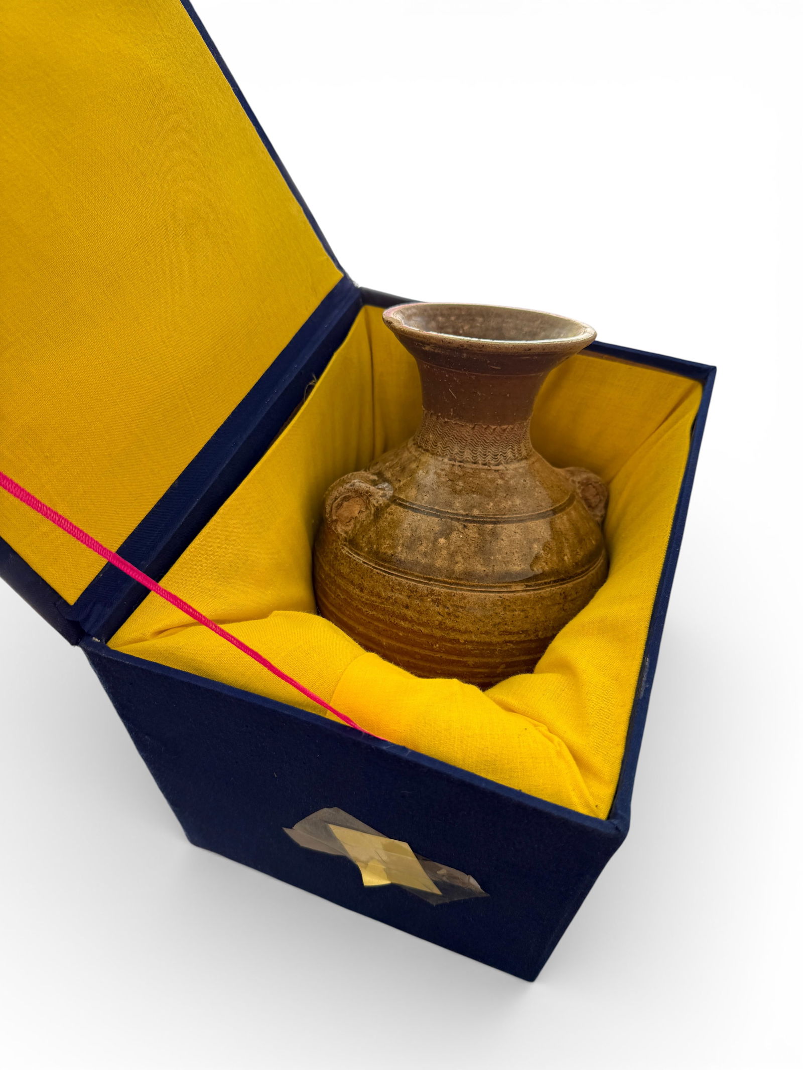 CHINESE HAN-DYNASTY STYLE EARTHENWARE STORAGE JAR: CHINESE HAN-DYNASTY STYLE EARTHENWARE STORAGE JAR: Yue ware hu form stoneware vase with two moulded and incised loop handles on the shoulder. A mottled olive green glaze, consisting of green, brown