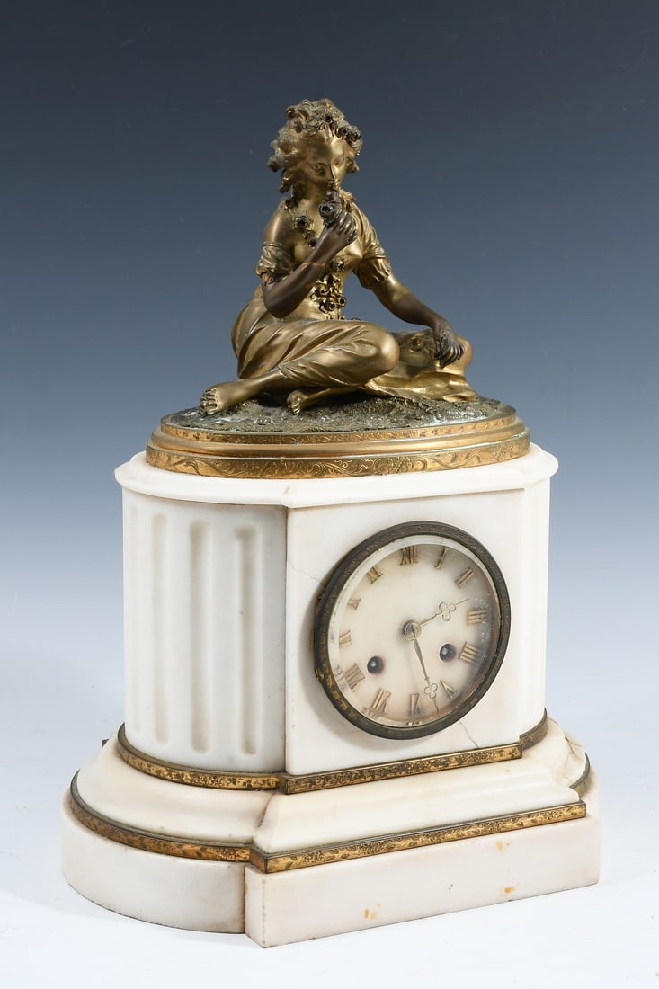 FRENCH FIGURAL GILT METAL & MARBLE CLOCK: FRENCH FIGURAL GILT METAL & MARBLE CLOCK: 19th-century French Marble mantel Clock, surmounted buy a Gilt Bronze Female figure smelling the Flowers. Japy Freres movement. Approx.
