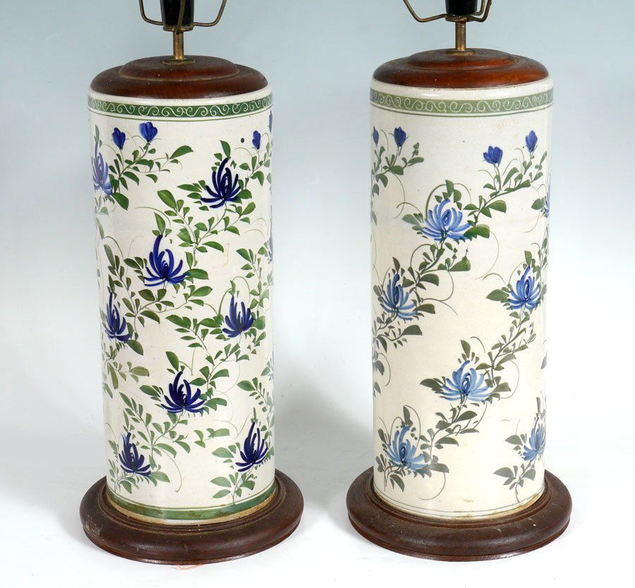 PAIR ORIENTAL EARTHENWARE LAMPS: PAIR ORIENTAL EARTHENWARE LAMPS: Floral motif pottery vases converted to lamps with wood base and top, single light fixture. Unsigned. Vase measures 15 3/4" h. x 6 1/4", overall 30" h. x 8 1/2".