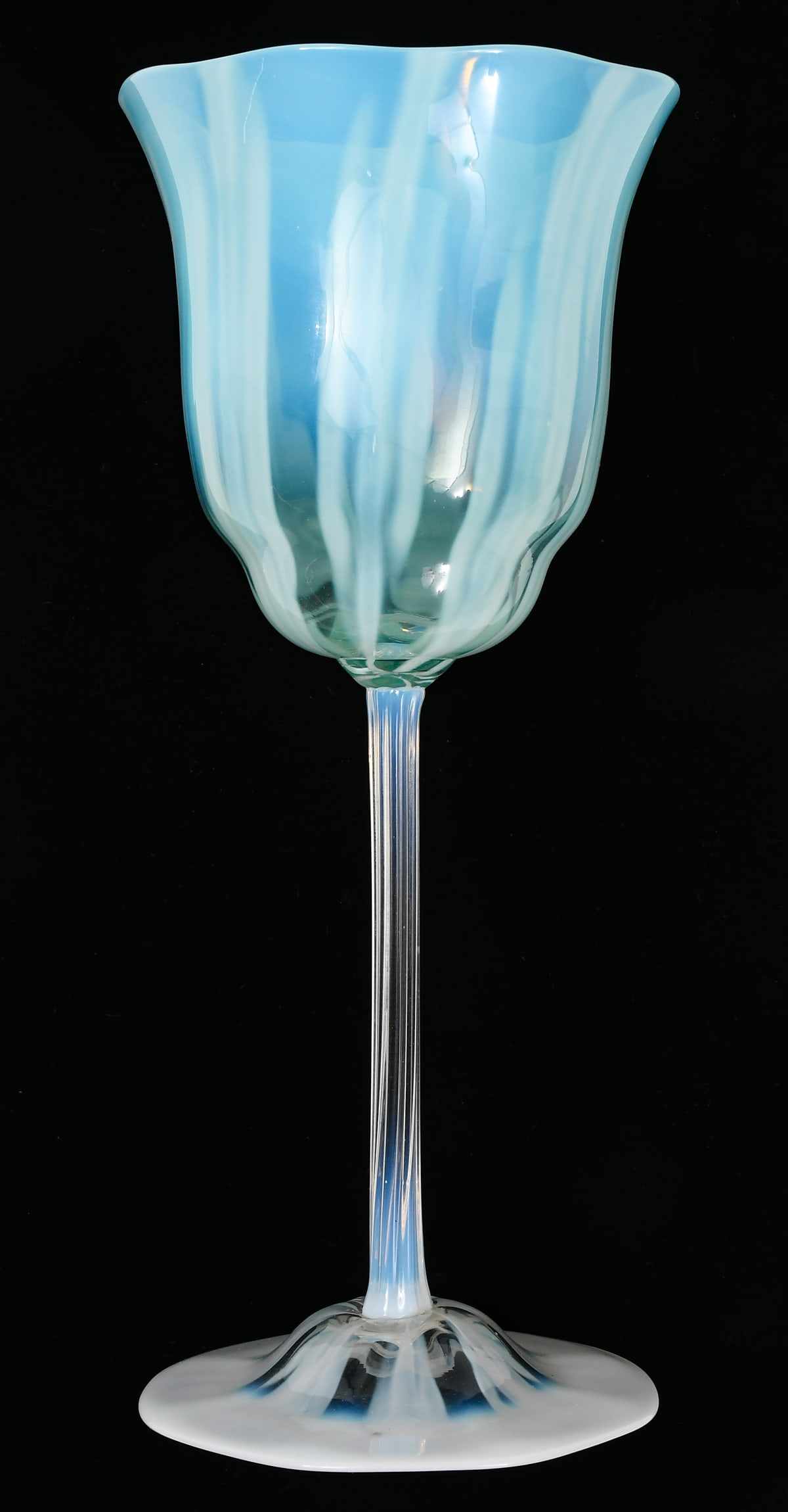 TIFFANY FAVRILE AQUA PASTEL GLASS GOBLET: TIFFANY FAVRILE AQUA PASTEL GLASS GOBLET: Circa 1920, having an opalescent white stem with a soft Aqua, floriform bowl. Underside etched "L.C.T.". Approx. 8.75" h x 3.75" dia.