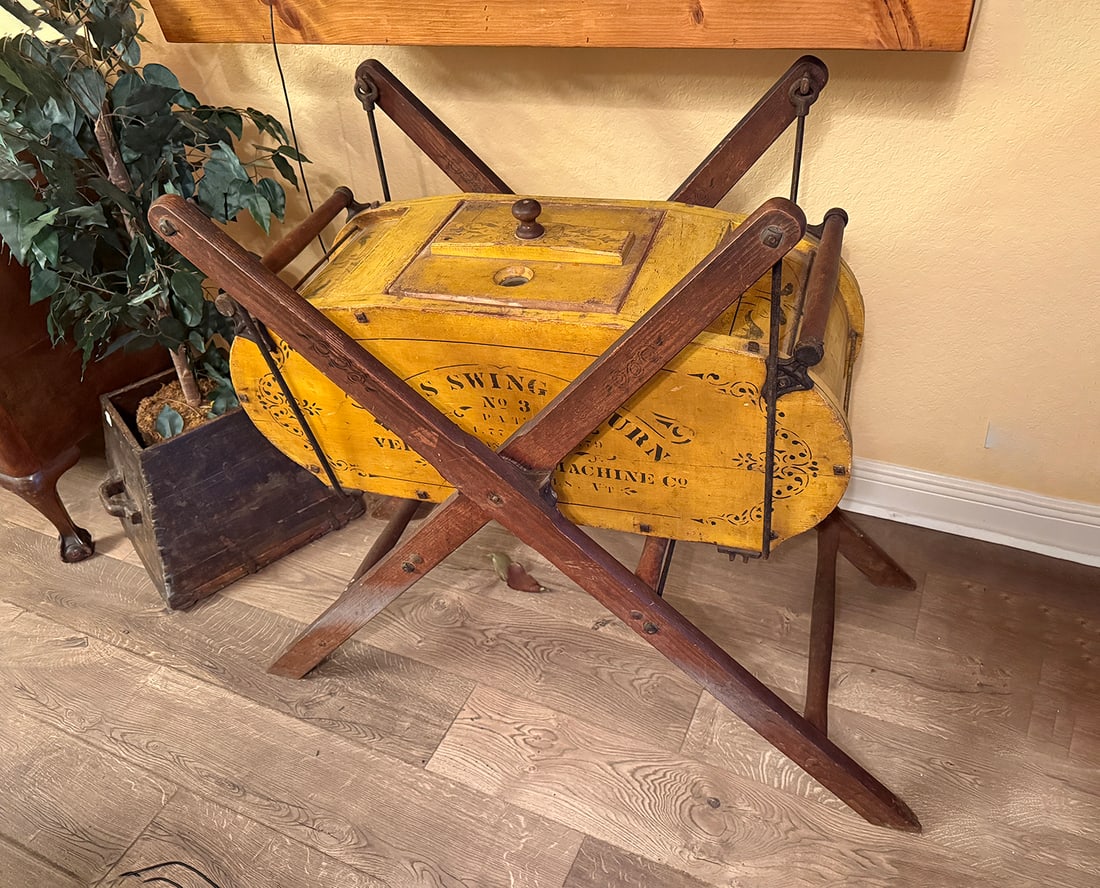 19TH-C "DAVIS" NO. 3 SWING BUTTER CHURN: 19TH-C "DAVIS" NO. 3 SWING BUTTER CHURN: Vermont Farm Machine Co., Bellows Falls, VT, retaining original stenciled yellow paint and iron mounted trestle swing frame.