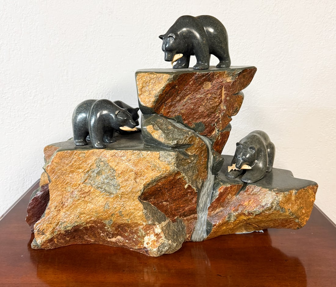 EDDIE LEE CARVED STONE BEARS SCULPTURE: LEE, Eddie, (Vietnamese/American, 20th/21st Century): Rock Formation with Bears after a Successful Fishing Hunt, Carved and Polished Stone, measures 14" (h) x 18" (w) x 8" (d), signed on the foot of t
