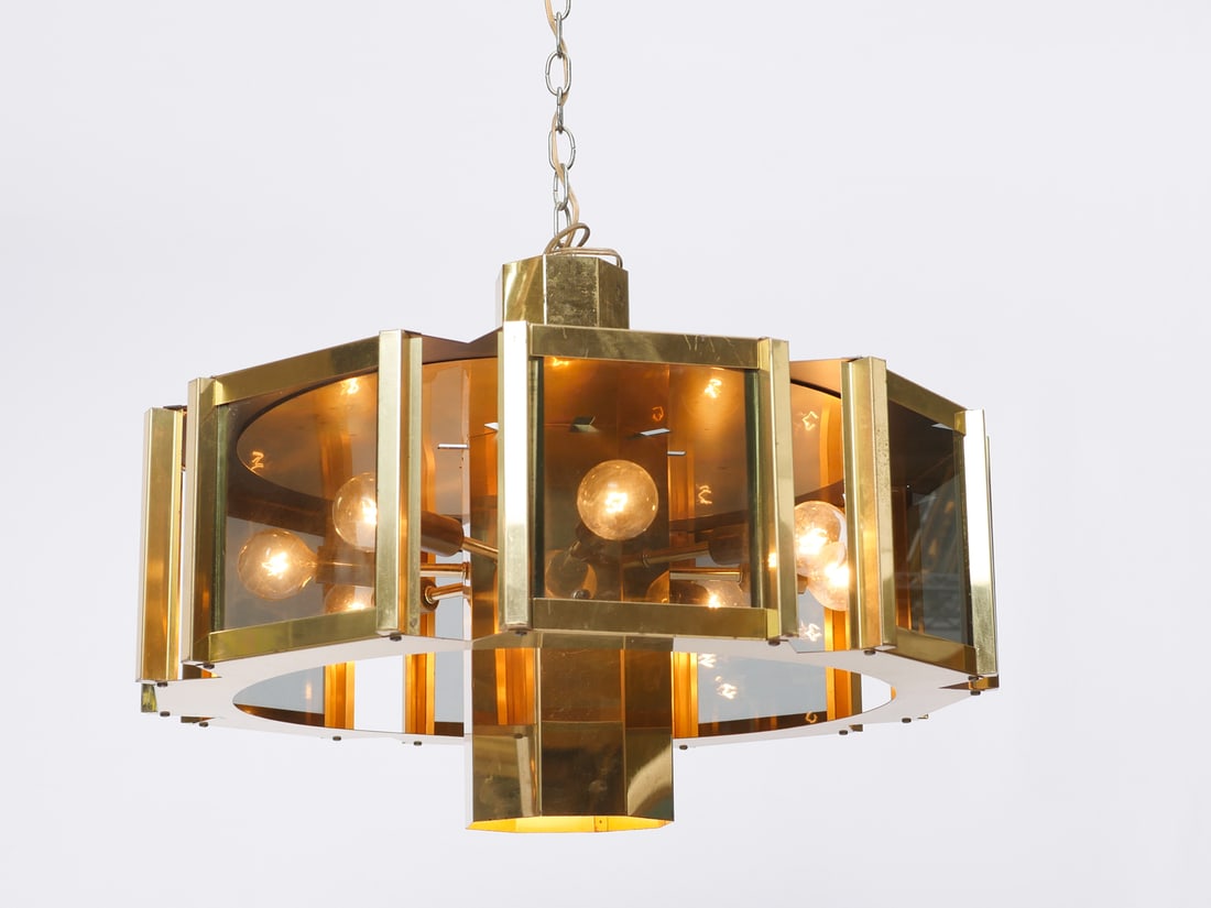 RAYMOND FREDERICK MODERNE CHANDELIER: RAYMOND FREDERICK MODERNE CHANDELIER: Frederick Raymond modern 9-light chandelier, having a gold toned frame with smoked glass panels, starburst configuration with one central light pointing down. App