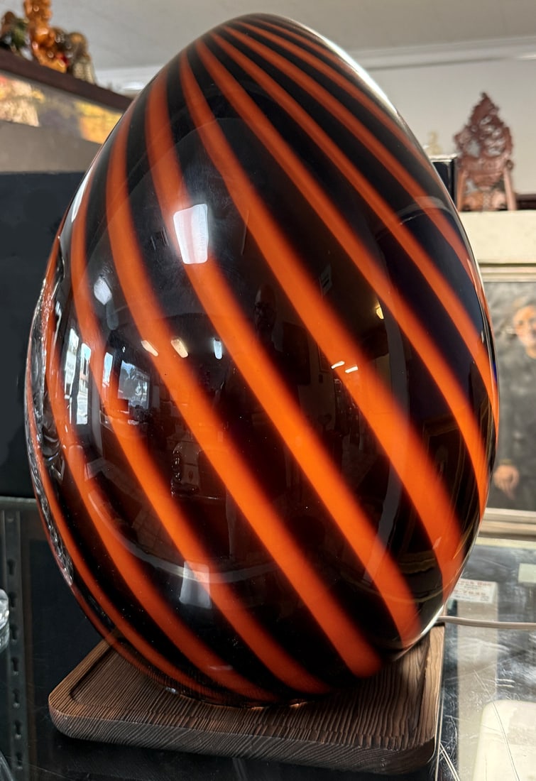 MURANO? GLASS SWIRL STRIPE EGG LAMP: MURANO? SWIRL STRIPE GLASS EGG LAMP: 19" h., unattached wooden base.