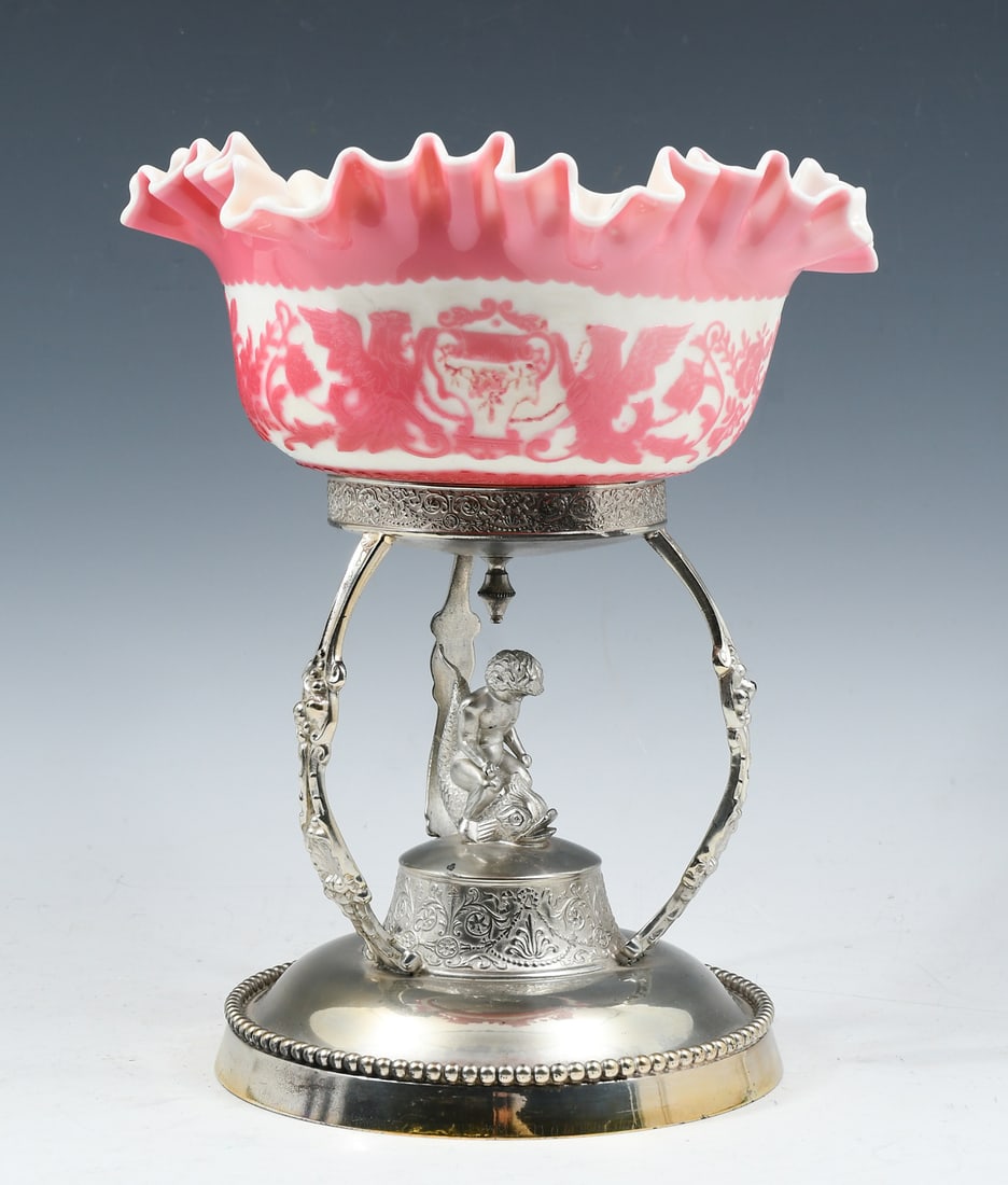 MT. WASHINGTON CAMEO GLASS BRIDE'S BOWL W/ STAND: MT. WASHINGTON CAMEO GLASS BRIDE'S BOWL W/ STAND: Opaque pink to opaque white, round body with a ruffled rim, griffins and floral pattern, polished pontil mark. Mt. Washington Glass Works. 1885-1895. 