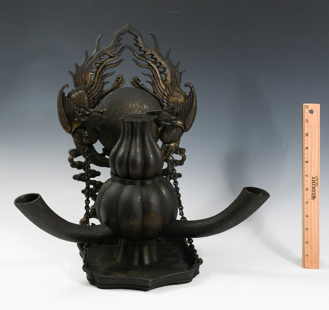 19TH-CENTURY CHINESE BRONZE CENSER: 19TH-CENTURY CHINESE BRONZE CENSER: Featuring a ribbed double gourd form body, resting on a chained shelf that has a Phoenix, Pearl of Wisdom, & stylized Cloud motif. Remnants of black paint possibly