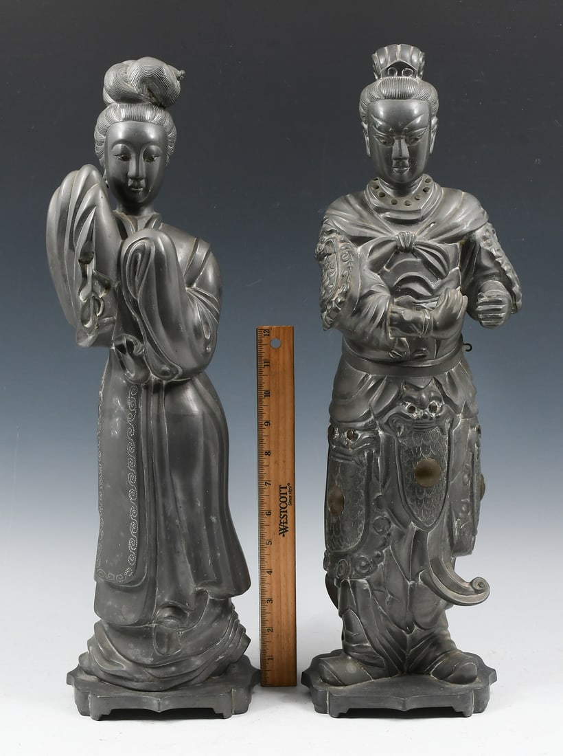 TWO LARGE CHINESE PEWTER FIGURES: TWO LARGE CHINESE PEWTER FIGURES: Comprising; 1- Female figure in a robe with incised scrolled border. 1- Male Warrior with Dragon motif armor. Both impressed "Made in Hong Kong". Largest Approx. 21"