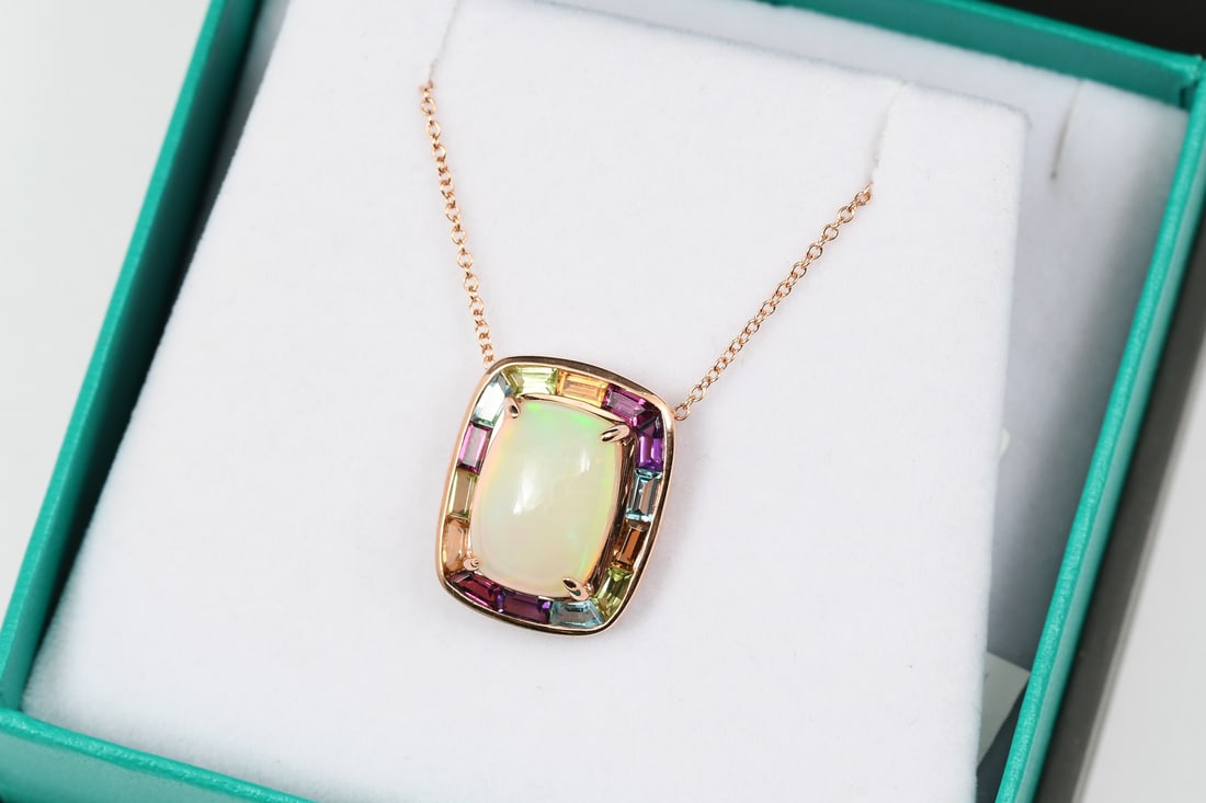 14K ROSE GOLD OPAL PENDANT: 14K ROSE GOLD OPAL PENDANT: 14K rose gold slide/pendant containing 5.88 CTW of gemstones to include a rectangular cabochon opal with amethyst, blue topaz, citrine, peridot and rhodolite. Marked EFFY P