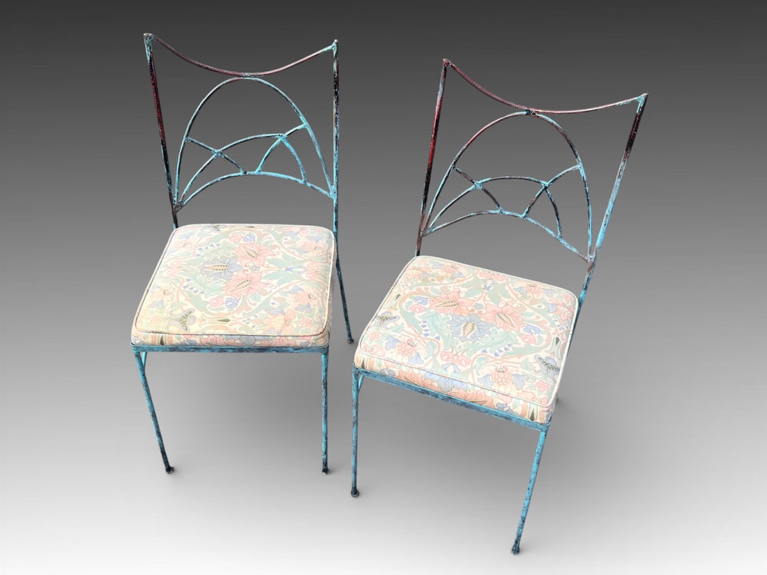 2 PC. LEE & SHARON JONES SCULPTURAL CHAIRS: 2 PC. LEE & SHARON JONES SCULPTURAL CHAIRS: Pair of Polychrome decorated Wrought Iron chairs, having an Abstract Geometric backrest and floral upholstered padded seats. Approx. 36" h x 17.25" w x 21" 