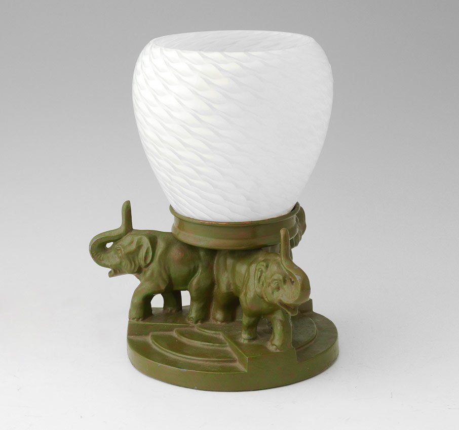 FRANKART STYLE ELEPHANT LAMP: FRANKART STYLE ELEPHANT LAMP: Green painted cast iron base with 3 elephants supporting fixture and replacement glass shade. Base measures 5 5/8" h. x 7". Shade 5 1/2" h. x 5 1/2".