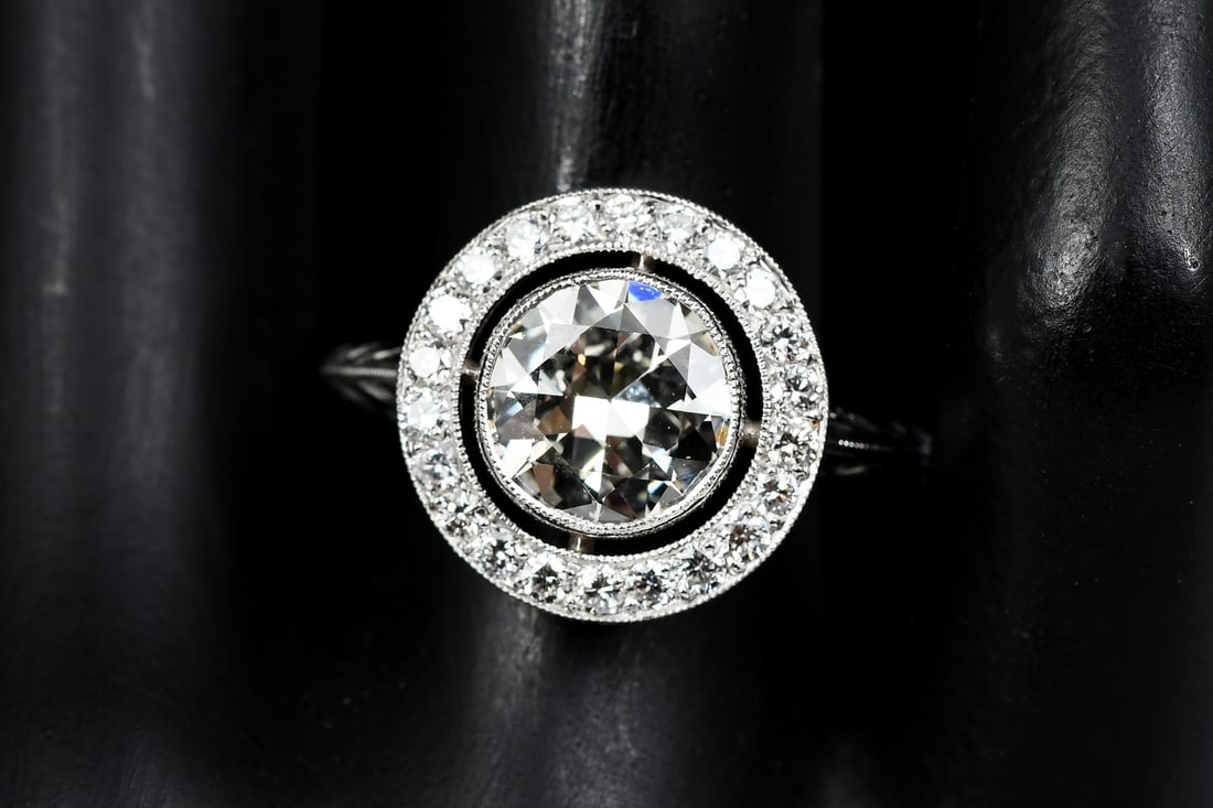 STUNNING PLATINUM EDWARDIAN REVIVAL DIAMOND RING: STUNNING PLATINUM EDWARDIAN REVIVAL DIAMOND RING: This incredibly gorgeous ring Ca. late 1940's 2.25 Ct. circular brilliant cut VVS2 with a diamond halo of 22 round brilliant cut diamonds. Center