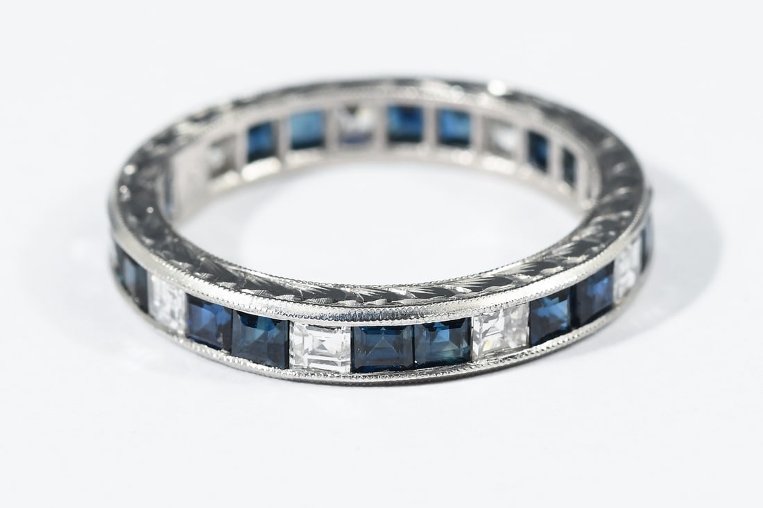 PLATINUM 3.34 CTW DIAMOND & SAPPHIRE ETERNITY BAND: PLATINUM 3.34 CTW DIAMOND & SAPPHIRE ETERNITY BAND: Platinum band contains (9) modified Asscher cut diamond Diamond weighing approximately 1.00 Ct. Rated VVS-VS in clarity and F-G in color. 26 square