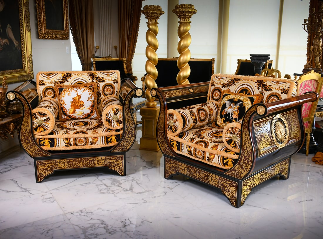 PR. INLAID VERSACE MEDUSA ARMCHAIRS: PR. INLAID VERSACE MEDUSA ARMCHAIRS: A Pair of luxurious Versace Medusa Lounge Chairs upholstered in a Black, Yellow, & Cream "Baroco Circle" Versace pattern fabric. Approx. 36" h x 47" w x 35.5" d.