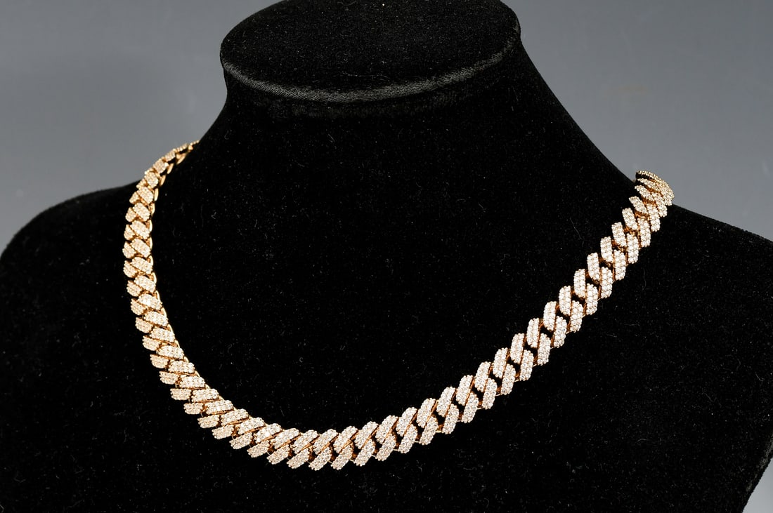 10K YELLOW GOLD "MIAMI" CUBAN LINK DIAMOND CHAIN: 10K YELLOW GOLD "MIAMI" CUBAN LINK DIAMOND CHAIN:10K yellow gold "Miami" Cuban link neck chain encrusted with approximately 1500 round brilliant cut diamonds. Diamond weight approximately 15 Ct. .