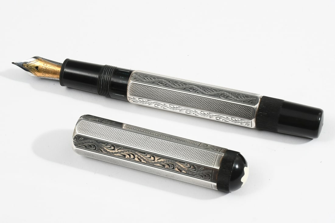 MONTBLANC PEN PATRON OF THE ARTS LORENZO DE MEDICI: MONTBLANC PEN PATRON OF THE ARTS LORENZO DE MEDICI: A Montblanc Patron de Arts Lorenzo de Medici Sterling No 1103/4810 German, 1992 faceted piston-filler with hand-engraved silver overlay, two-color