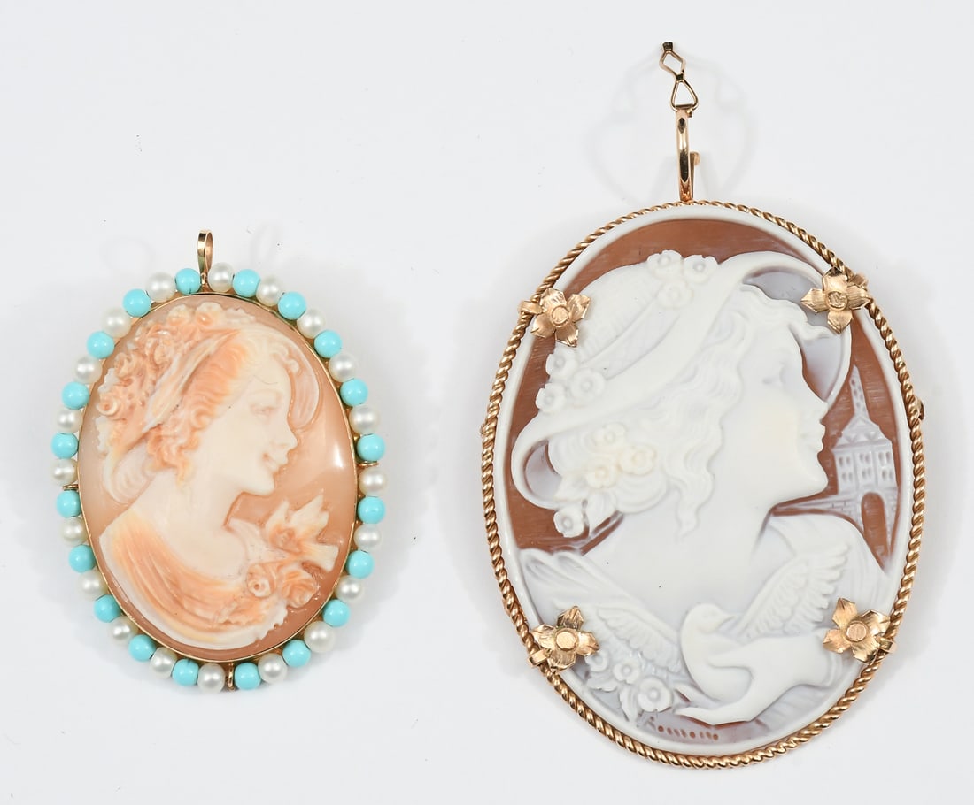 2 LARGE 14K SHELL CARVED CAMEOS: 2 LARGE 14K SHELL CARVED CAMEOS: 14K brooch/pendant contains one 55.00 x 50.00 mm oval cameo depicting a modern female, dove and church. Locking bar pin closure and figure eight bail. Cameo is signed.