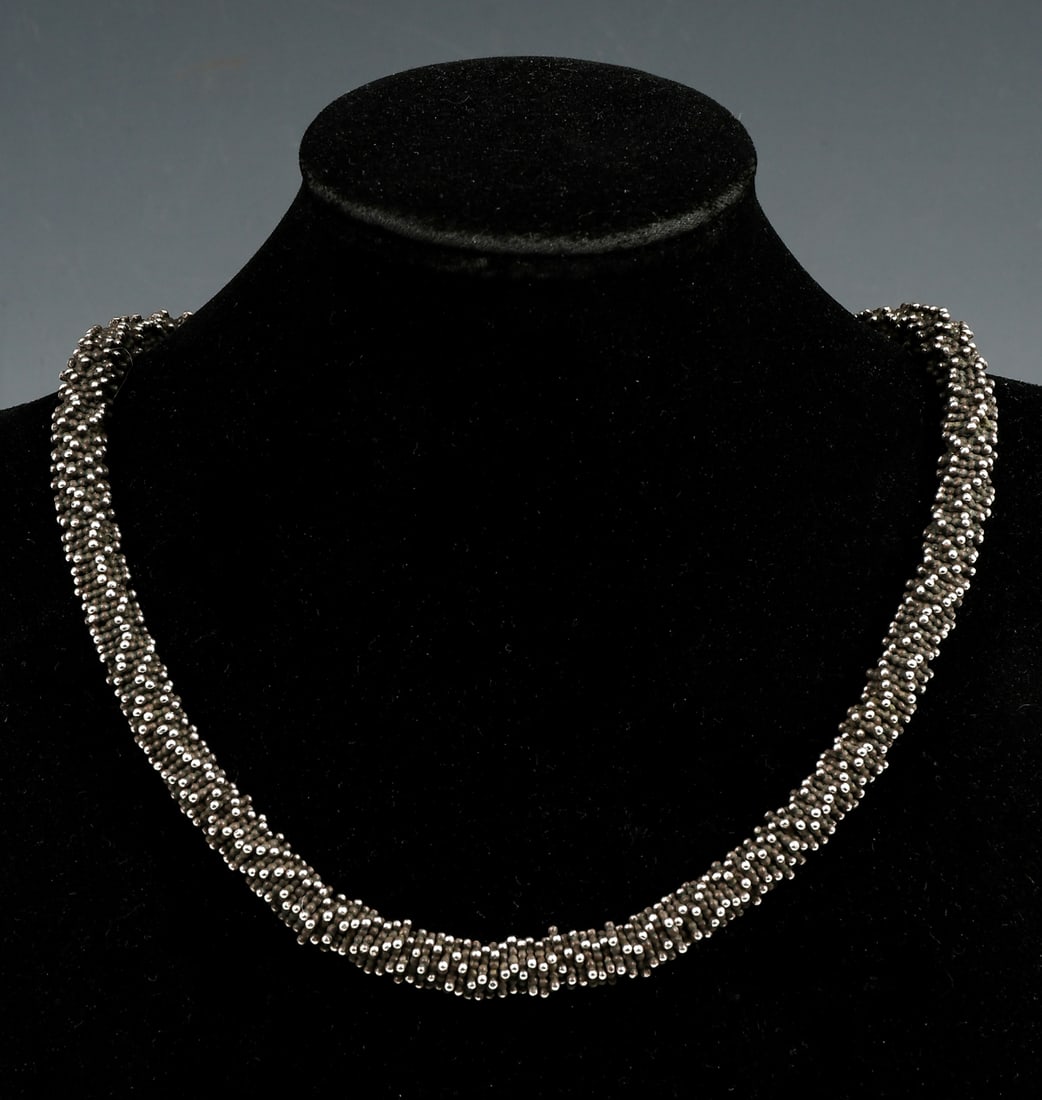 STERLING NECKLACE IN THE STYLE OF MICHAEL DAWKINS: STERLING NECKLACE IN THE STYLE OF MICHAEL DAWKINS: Heavy sterling bracelet with caviar granulated style beads in the style of Michael Dawkins. Length: approximately 18.5". Weight: 4.56 ozt.