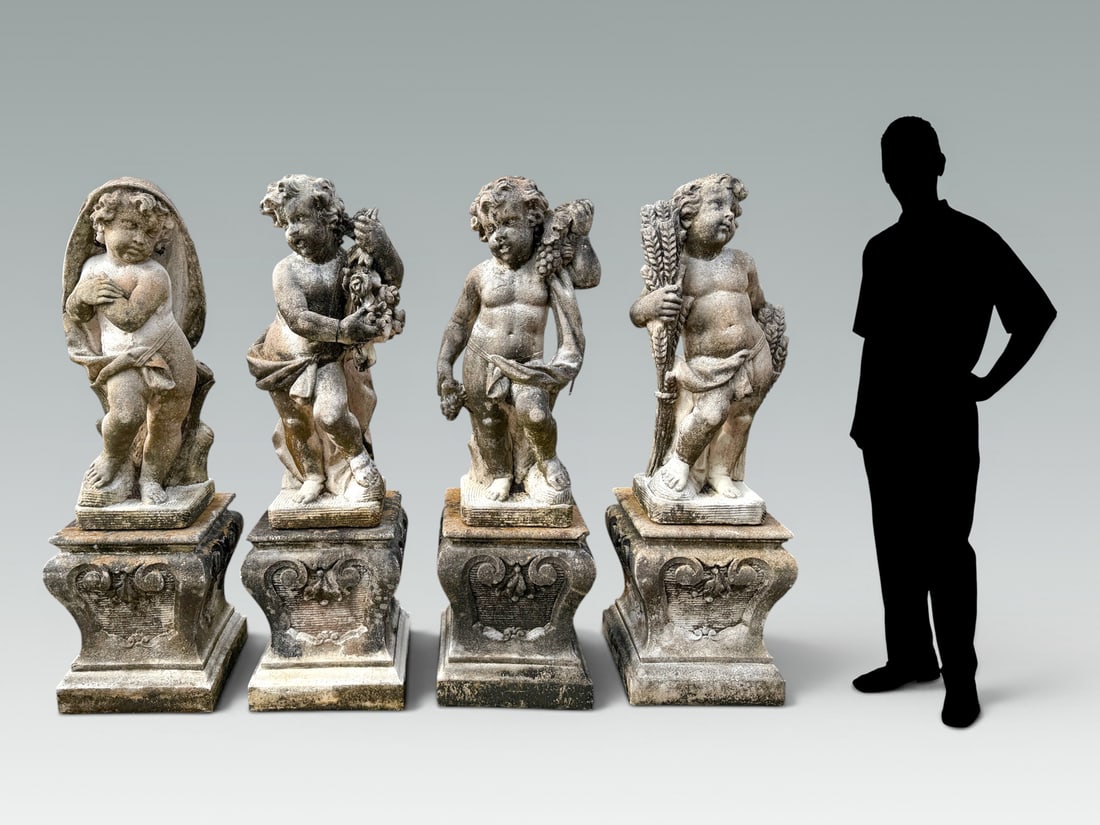 FOUR SEASONS GARDEN STATUES WITH PEDESTAL BASES: FOUR SEASONS GARDEN STATUES WITH PEDESTAL BASES: Set of cherubs representing spring, summer, autumn, and winter, resting on short column plinths. Each cherub measures 36.5" in height and stands 56"