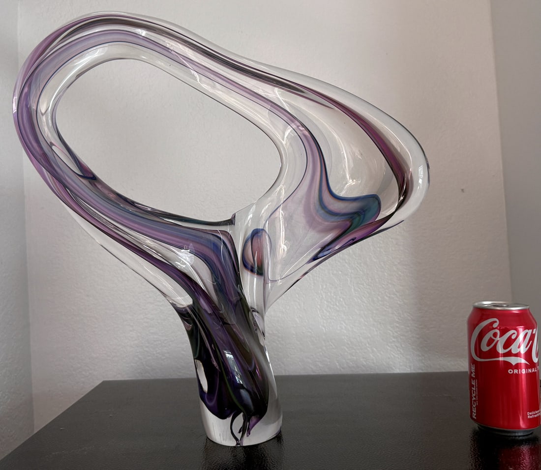 DAVID GOLDHAGEN FREEFORM ART GLASS SCULPTURE: GOLDHAGEN, David, (American, b. 1957): Amorphous Shape in Purple and Clear Glass, signed at foot, measures 17.75" in height.