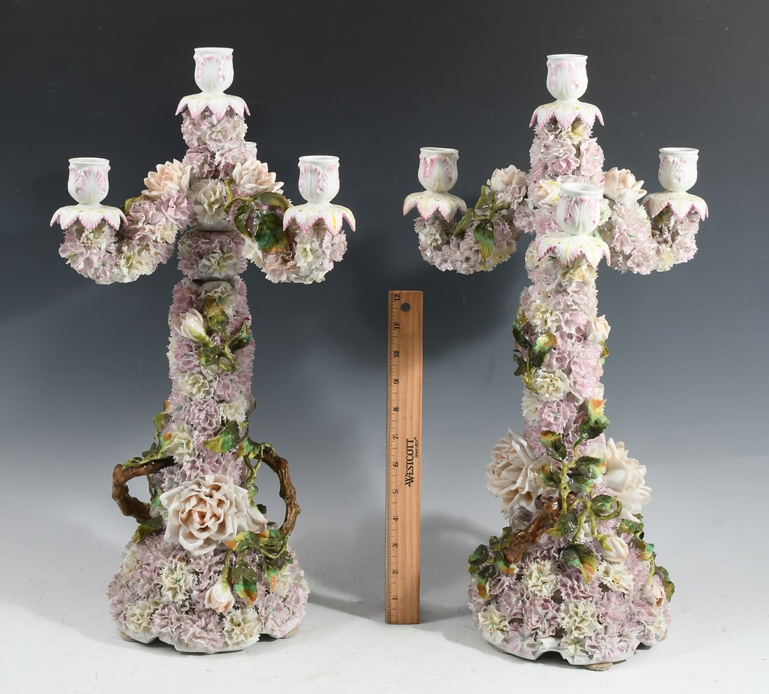 ANTIQUE PR. OF GERMAN PORCELAIN CANDELABRA: ANTIQUE PR. OF GERMAN PORCELAIN CANDELABRA: Pair of 4- light Candelabra, probably Dresden, featuring applied floral decorations. Branch form handles. Approx. 20.25" h x 10.5" w x 9.5" d.