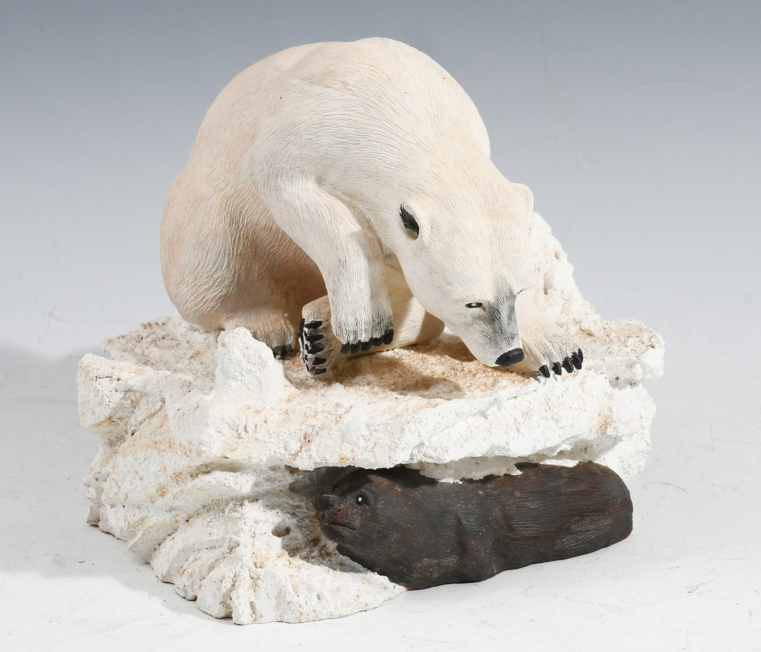 JACK FREEMAN POLAR BEAR WOOD CARVING: JACK FREEMAN POLAR BEAR WOOD CARVING: Carved and painted from one block of wood, depicts a hungry Polar Bear peering down at an elusive seal, approximately 6'' h. x 7'' w., signed underneath.