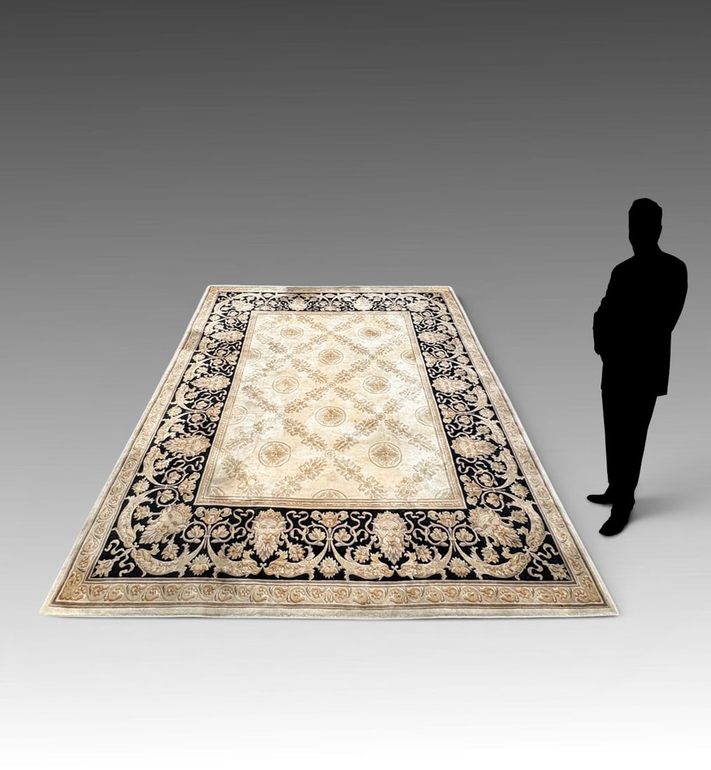 MANNER OF VERSACE HAND-KNOTTED SAVONNERIE REVIVAL CARPET: MANNER OF VERSACE HAND-KNOTTED SAVONNERIE REVIVAL CARPET: Having Sculpted Wool pile and Neoclassical Green Man/Bacchus Masqueron Borders in the Manner of Versace Home Design. Grey field with classic b