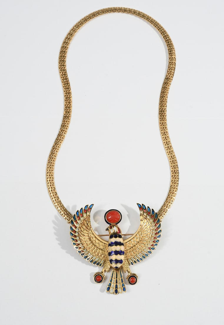 18K EGYPTIAN REVIVAL HORUS FALCON BROOCH/PENDANT: 18K GOLD EGYPTIAN REVIVAL HORUS FALCON BROOCH/PENDANT & CHAIN: 18K yellow gold Egyptian Revival stylized phoenix bird with plique a jour and champleve red, white and blue enamel decoration. 1 red cora