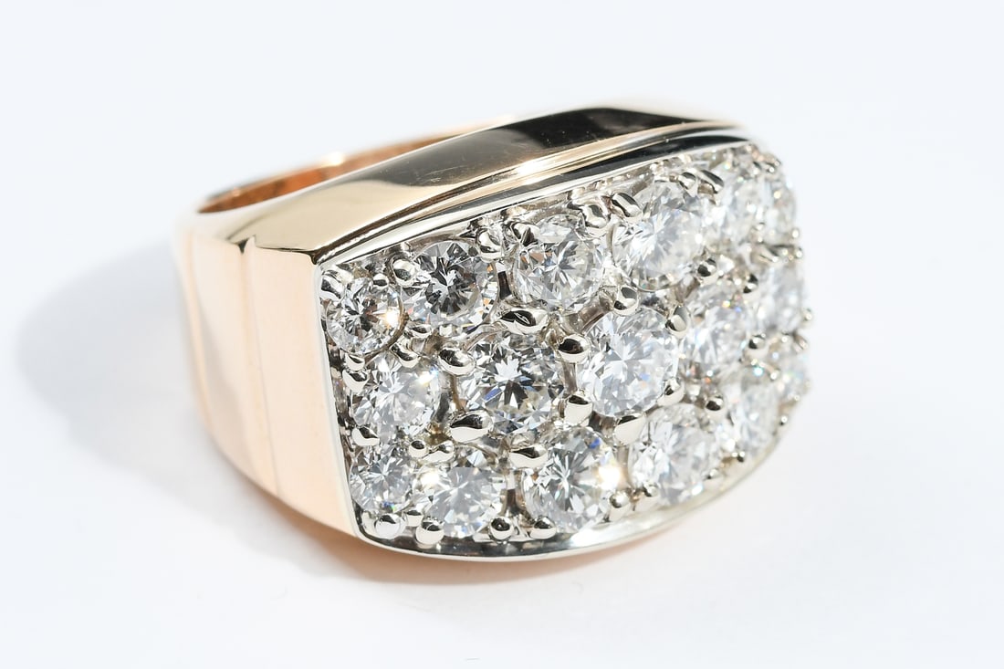 14K 2-TONE DIAMOND POWER RING: 14K 2-TONE DIAMOND POWER RING: A 14K yellow and white gold diamond ring contains17 round brilliant cut diamonds with an approximate total diamond weight of 4.25 Ct. rated VS1-SI1 in clarity and H-I in