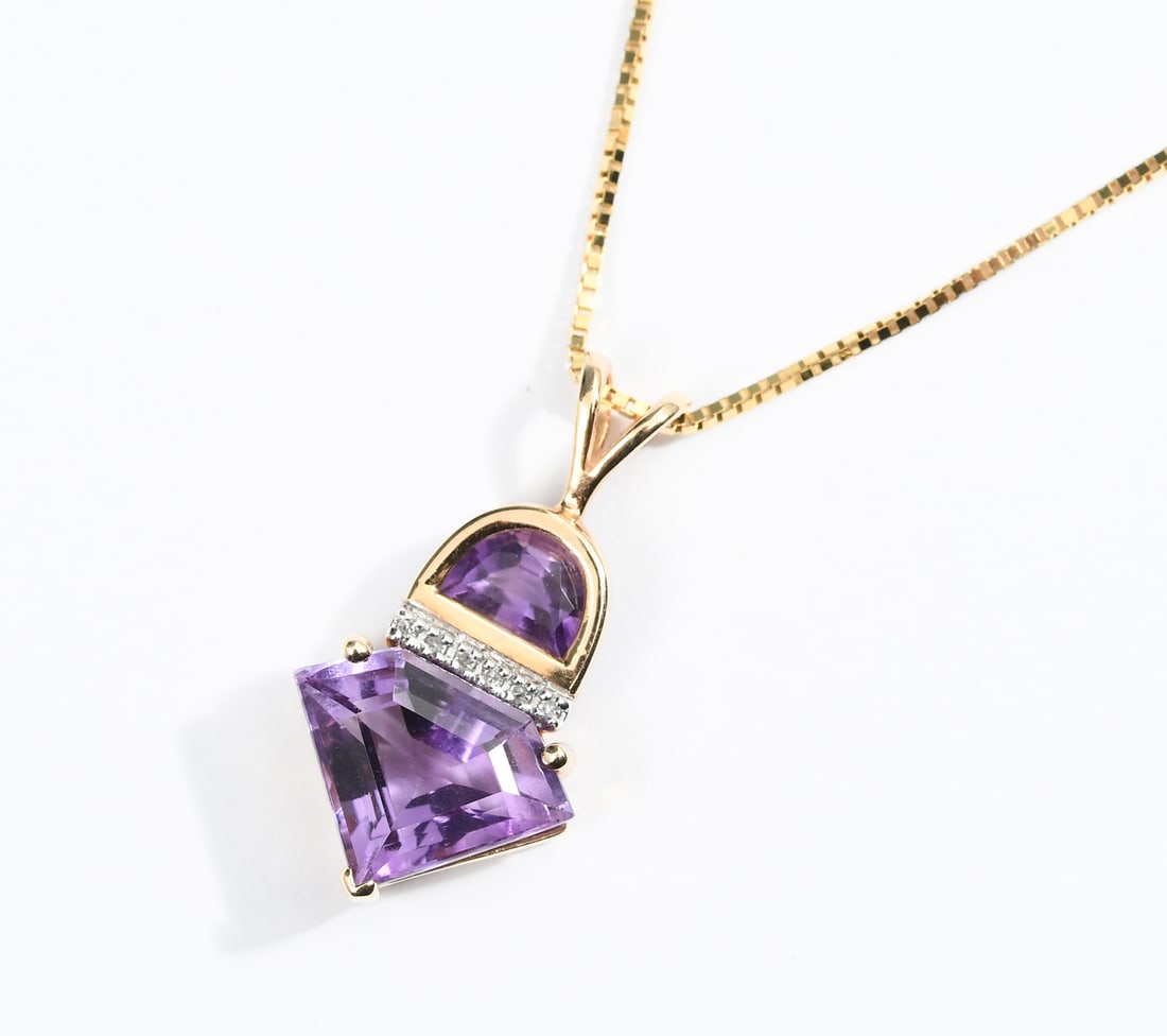 14K GOLD AMETHYST DIAMOND PENDANT ITALIAN BOXLINK: 14K GOLD AMETHYST DIAMOND PENDANT ITALIAN BOXLINK: 14K yellow gold pendant contains one faceted diamond shaped amethyst and one faceted half moon shaped amethyst. WEIGHT: 3.50 Ct. Approx. 6 round sing
