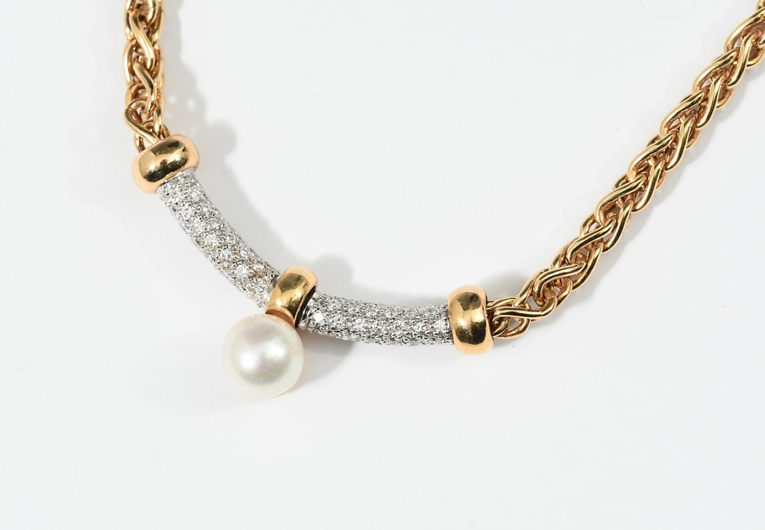 18K PEARL & DIAMOND NECKLACE: 18K PEARL & DIAMOND NECKLACE: 18k yellow gold pearl and diamond necklace has a diamond encrusted bar and articulating 8mm cultured pearl. Diamond weight: approximately 0.50 Ct. Length: approximately 1