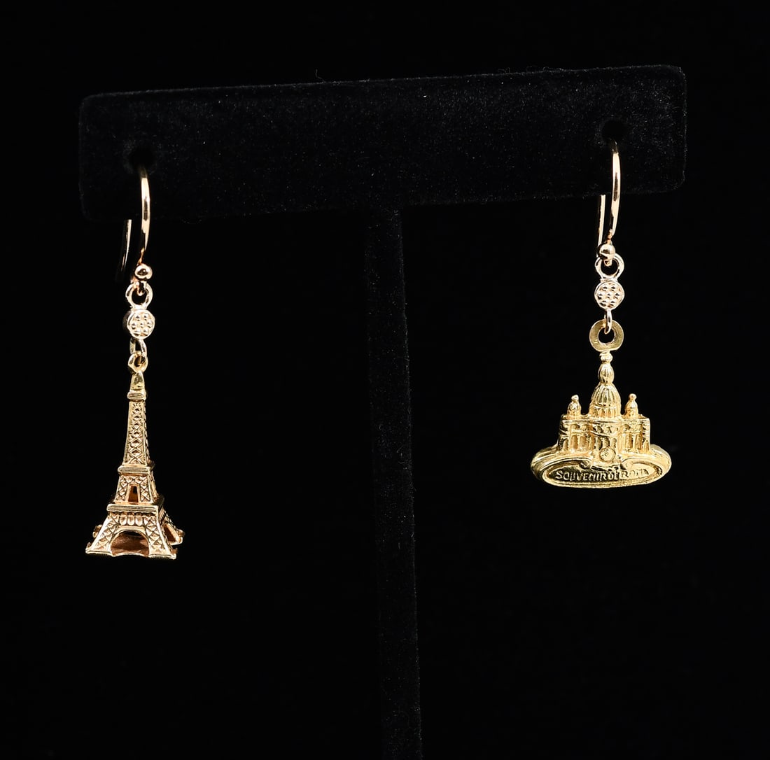 18K PARIS/ROME SOUVENIR EARRINGS: 18K PARIS/ROME SOUVENIR EARRINGS: 18K yellow gold with Eiffel Tower and St. Peter Basilica/Vatican City Rome charms on wire earrings. Total weight: 6.1 grams.