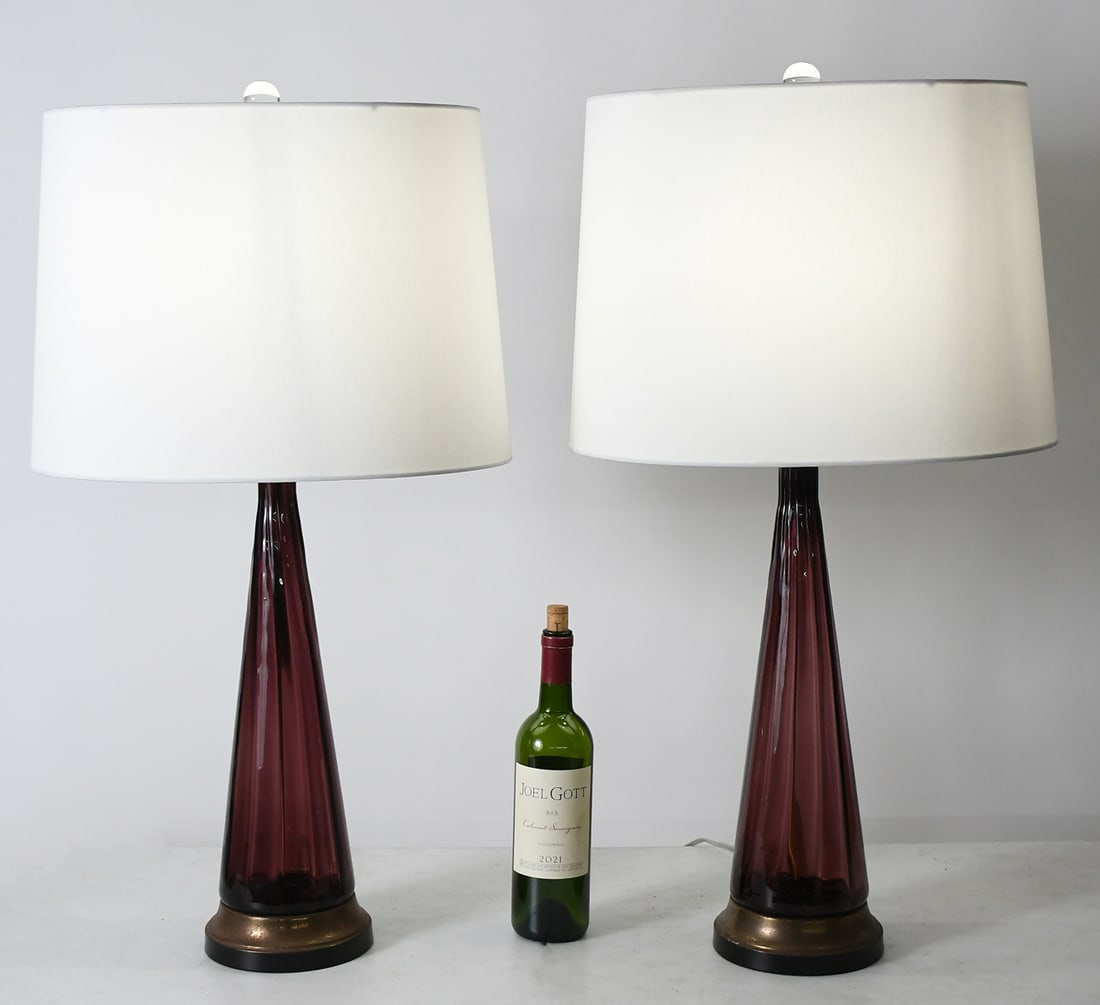 PR. GLASS MID CENTURY LAMPS: PR. MCM ITALIAN ART GLASS TABLE LAMPS: Pair of Italian Mid-Century Modern Table Lamps, having a tapered Amethyst Glass bodies on a metal base. Single light, White Cloth on paper oblong shades. Approx.