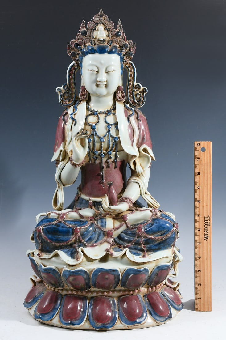 CHINESE PORCELAIN GAUNYIN BUDDHA ON A LOTUS THRONE: CHINESE PORCELAIN GAUNYIN BUDDHA ON A LOTUS THRONE: Large Chinese Porcelain statue of Guanyin holding a bottle with the Water of Life sitting in a meditative position upon a Double Lotus form base. Re
