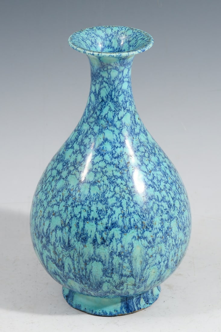 CHINESE JUN GLAZED PORCELAIN YUHUCHUNPING VASE: CHINESE JUN GLAZED PORCELAIN YUHUCHUNPING VASE: A Chinese bottle form vase with a Mottled Blue or Robin's Egg Glaze. Impressed "Made during the Yongzheng Period of the Qing Dynasty" mark. Approx. 8" h