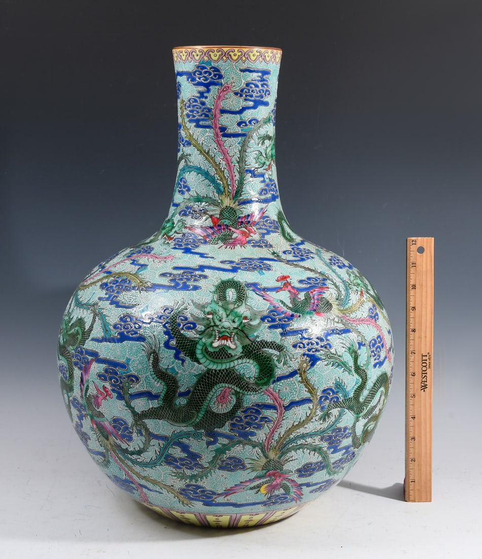CHINESE FAMILLE ROSE PORCELAIN NINE-DRAGON VASE: CHINESE FAMILLE ROSE PORCELAIN NINE-DRAGON VASE: Large Finely enameled Chinese Famille Rose Tianquiping or Globular form vase, having a Turquoise ground with 9- Dragons and Phoenix flying amongst styl