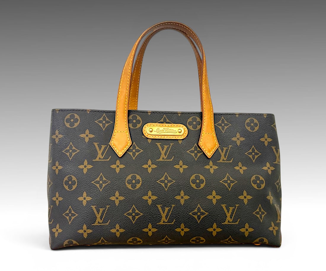 LOUIS VUITTON WILSHIRE PM TOTE BAG: LOUIS VUITTON WILSHIRE PM TOTE BAG: Chic and compact Louis Vuitton Wilshire PM tote in monogram coated canvas featuring natural vachetta leather handles and gold tone brass hardware, clasp closure, on