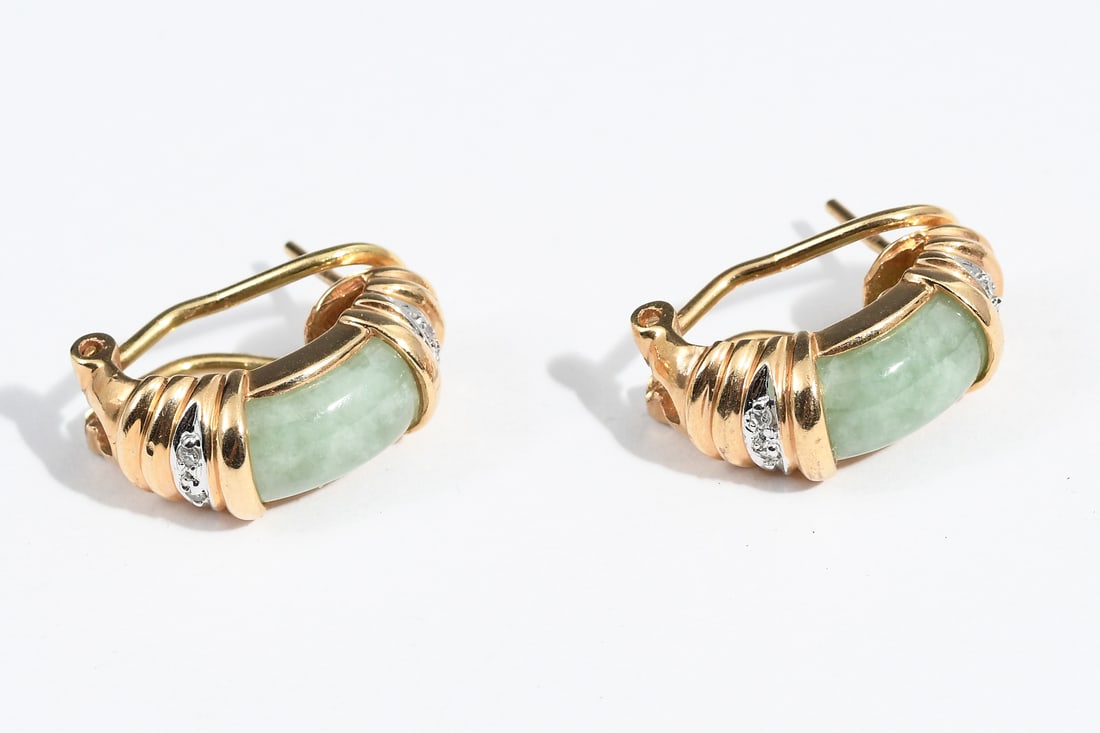 14K DIAMOND & JADE EARRINGS: 14K DIAMOND & JADE EARRINGS: 14K yellow gold earrings contain 2 curved cabochons of light green nephrite jade. 9 round single cut diamonds. WEIGHT: .05 Ct. Approx. Rated SI in clarity and H-I in color