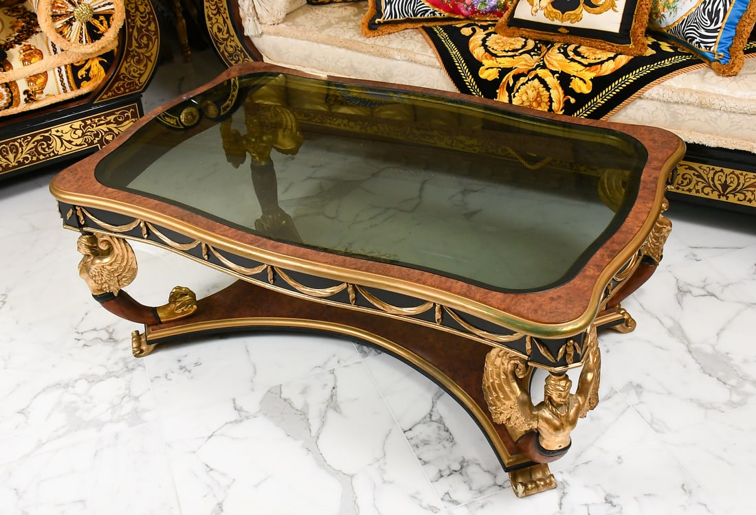 STATUS ITALIAN GILTWOOD WINGED MAIDEN TABLE: STATUS ITALIAN GILTWOOD WINGED MAIDEN COFFEE TABLE: Nedo Susini for Stile Legno Italian Coffee Table, having carved & Gilt Winged Maiden legs, shaped stretcher, raised on Lion's Paw feet. Once graced 