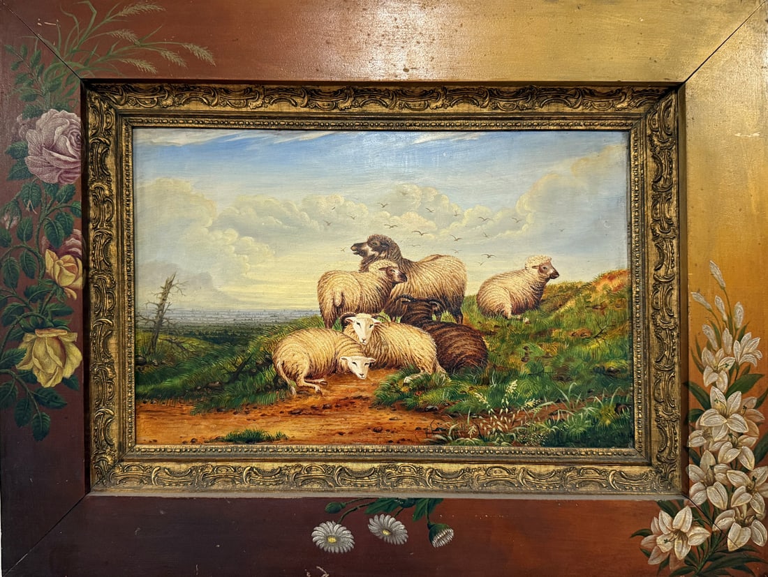 NAIVE FOLK ART SHEEP PAINTING WITH PAINTED FRAME: NAIVE FOLK ART SHEEP PAINTING WITH PAINTED FRAME: Six Sheep in a Pastoral Landscape, Oil/Panel, 12" x 18.375", no visible signature, wood frame painted with three varieties of flowers, 20.5" x 27".
