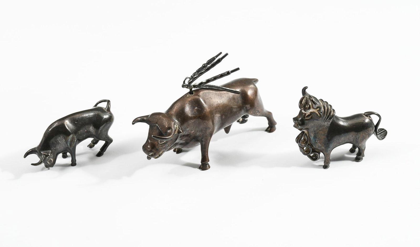 3 PC. PERUVIAN STERLING SILVER BULL FIGURINES: 3 PC. PERUVIAN STERLING SILVER BULL FIGURINES: Approx. 6.19 Troy ounces. Comprising; 1- Bull with removable Pikes at shoulders. 1- Bull with an articulated removable tail. 1- Bull Grazing. All