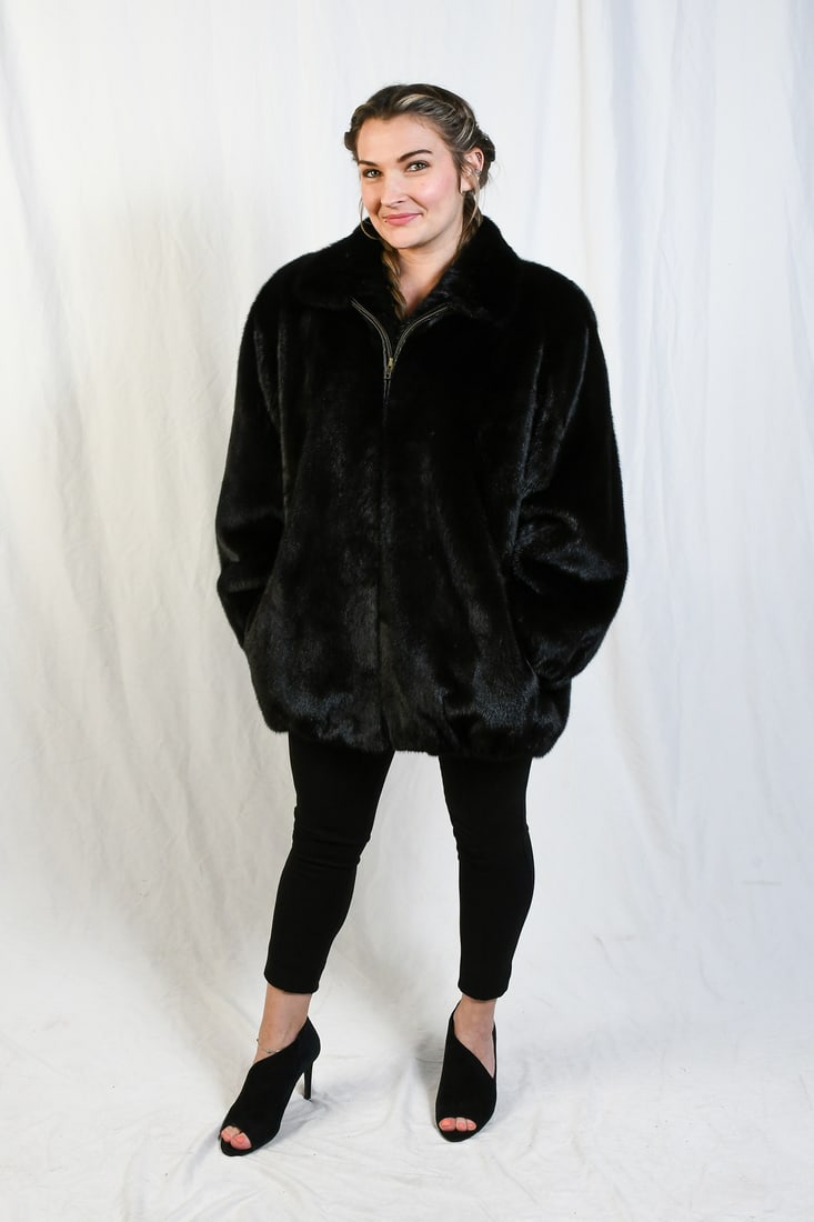 IMMACULATE BLACK MINK JACKET: IMMACULATE BLACK MINK JACKET: Great looking black mink zippered jacket has a black satin lining and 2 side slit pockets. Zipper is leather trimmed. Approx. size 12. Measurements approximate: length -