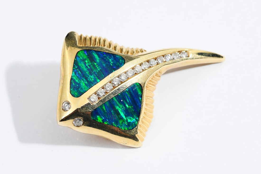 14K OPAL AND DIAMOND STINGRAY PENDANT: 14K OPAL AND DIAMOND STINGRAY PENDANT: 14K yellow gold pendant contains 2 inlaid freeform blue/green black opal doublets. 15 round brilliant cut diamonds. Weight: .46 Ct. Approx. Rated SI-I1 in
