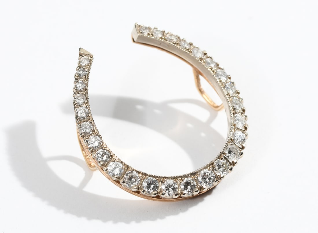 14K 1.50 CTW DIAMOND HORSESHOE PENDANT: 14K 1.50 CTW DIAMOND HORSESHOE PENDANT: 14K yellow gold pendant contains 27 round brilliant cut diamonds. Weight: 1.50 Ct. Approx. Rated VS in clarity and H-I in color. Diamonds are prong set. Total w
