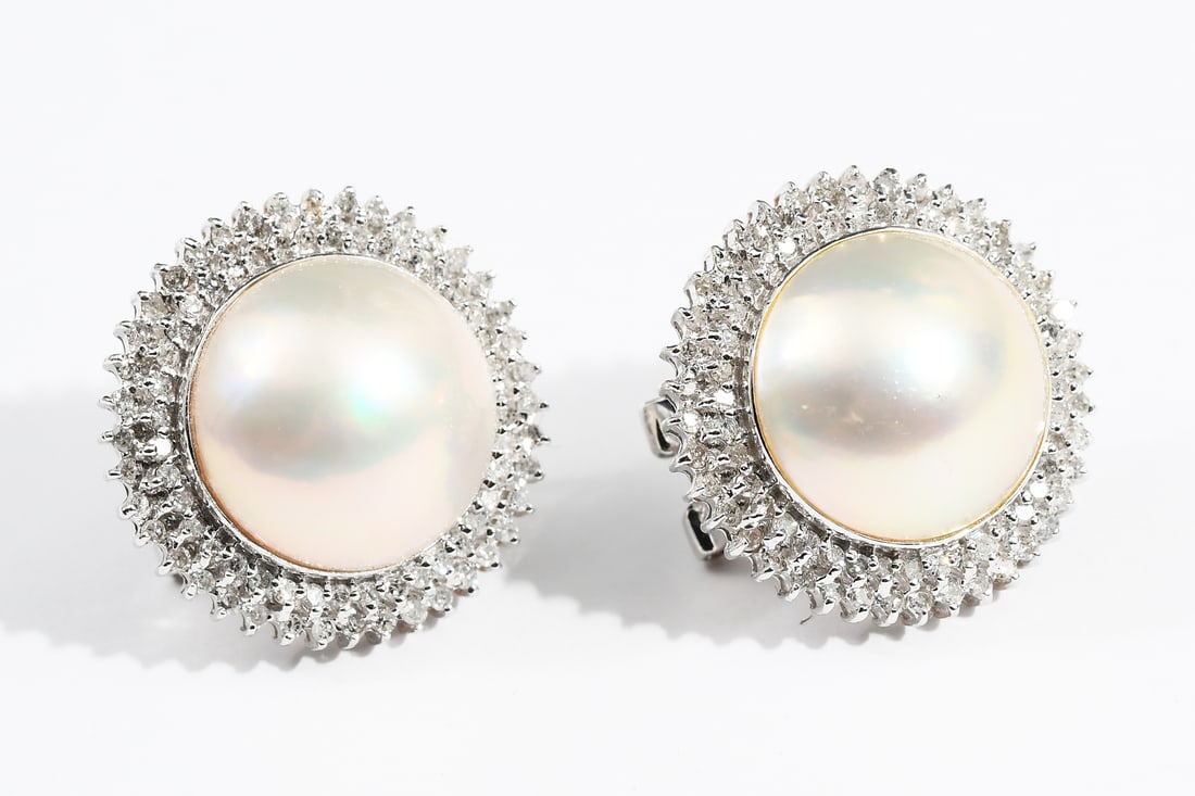 14K MABE PEARL & DIAMOND EARRINGS: 14K MABE PEARL & DIAMOND EARRINGS: 14K white gold earrings containing 2 15.00 mm round cultured mabe pearls. 160 round single cut diamonds. WEIGHT: .75 Ct. Approx. Rated I1 in clarity and H-I in color