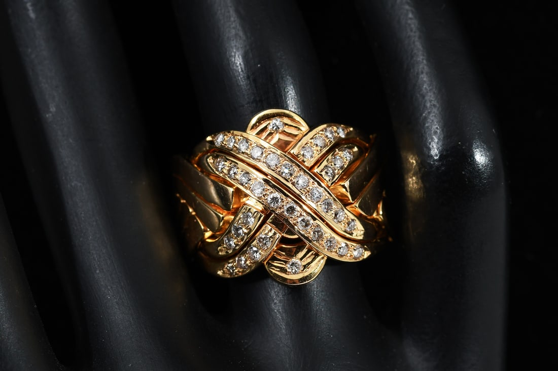 14K VINTAGE DOMED DIAMOND PUZZLE RING: 14K VINTAGE DOMED DIAMOND PUZZLE RING: 14K yellow gold domed puzzle ring contains 38 small round brilliant cut diamonds in champagne and white colors. Diamonds are bead set. Ring size: 11.5. Total wei