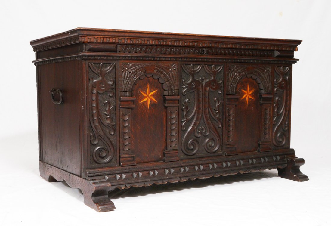 CARVED & INLAID BLANKET CHEST: CARVED & INLAID BLANKET CHEST: Carved front with figural mythological creatures, inlaid 6 sided stars, shaped skirt and feet. Iron hardware. 23'' h. x 39 3/4'' x 23 1/2''.