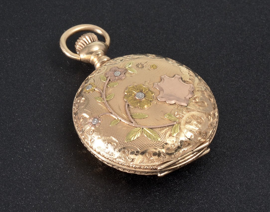 14K GOLD 1901 WALTHAM POCKET WATCH: 14K MULTI COLOR GOLD WALTHAM HUNTER CASE POCKET WATCH: Circa 1901, size 0 hunter case with floral motif, 7 jewel movement, pendant wind and set, serial #9558562.