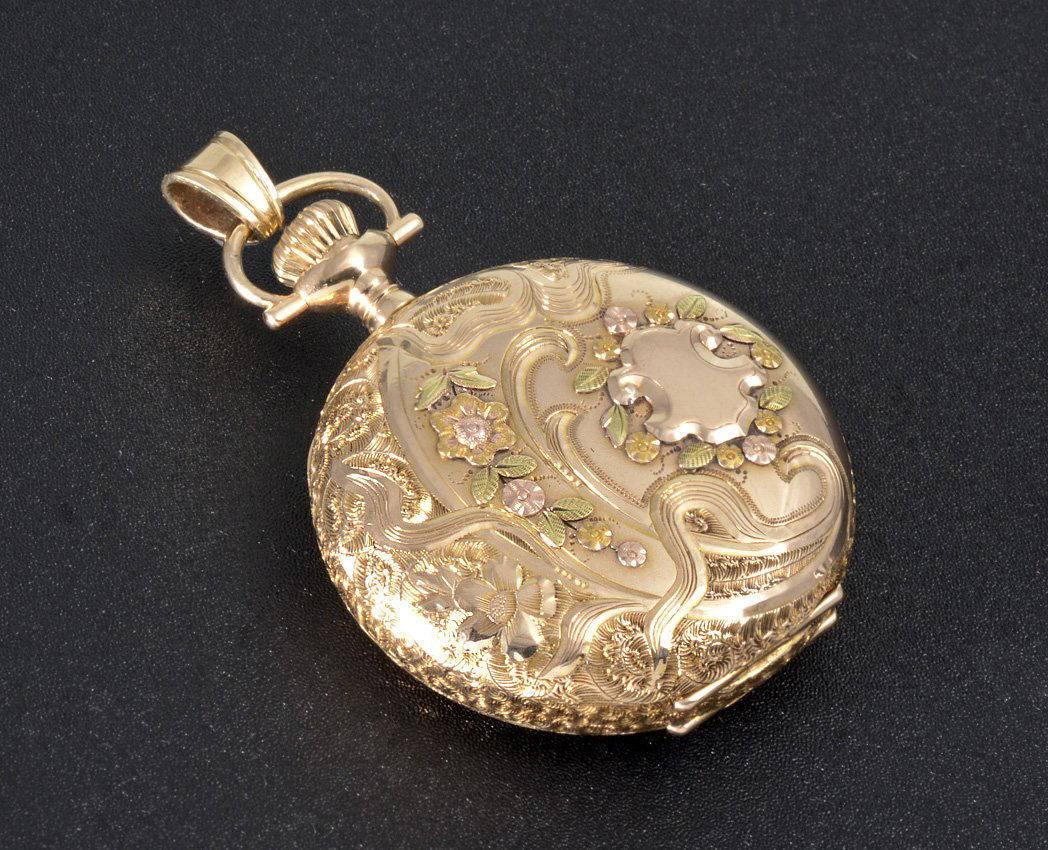14K GOLD 1913 ELGIN POCKET WATCH: 14K MULTI COLORED GOLD ELGIN HUNTER CASE POCKET WATCH: Circa 1913, size 0 hunter case set with tiny emerald in center of star, separate spring loaded black metal cover case, 15 jewel movement, pendant
